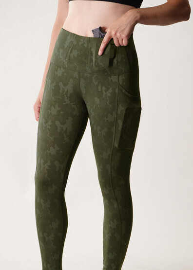 Alexo Women's Face Forward Concealed Carry Leggings features an OD green camo pattern